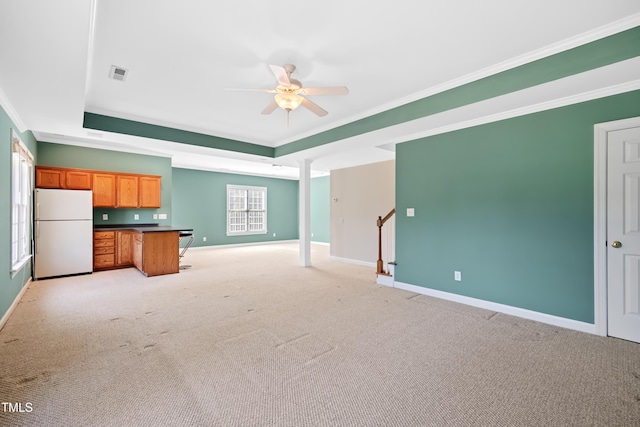306 Neuse Ridge Dr, Clayton, NC 27527 - unfurnished living room featuring crown molding, a ceiling fan, a raised ceiling, light carpet, and stairs