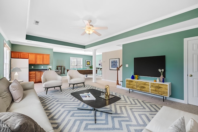 306 Neuse Ridge Dr, Clayton, NC 27527 - living room with a ceiling fan, light colored carpet, ornamental molding, and a tray ceiling