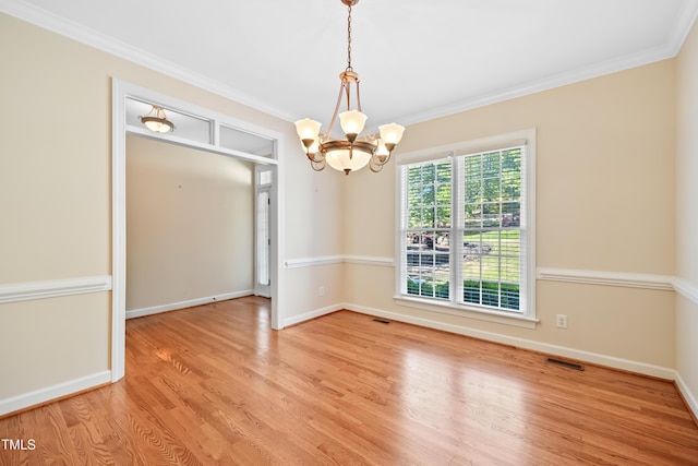 306 Neuse Ridge Dr, Clayton, NC 27527 - unfurnished room with a chandelier, wood finished floors, and ornamental molding