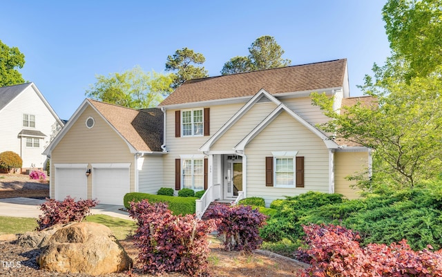 306 Neuse Ridge Dr, Clayton, NC 27527 - traditional-style home with concrete driveway, a garage, and roof with shingles