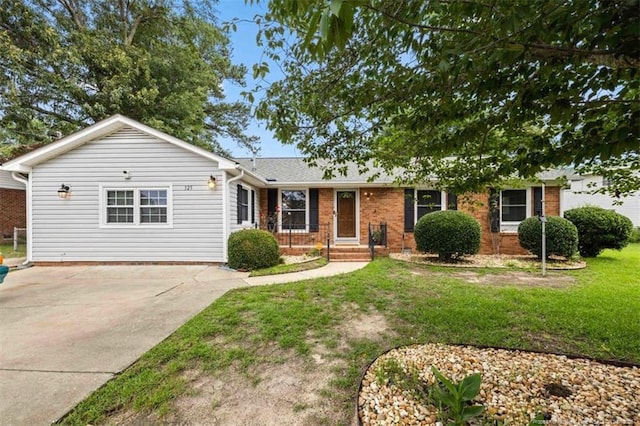 325 Hamilton St, Fayetteville, NC 28301 - ranch-style home featuring concrete driveway, brick siding, and a front yard