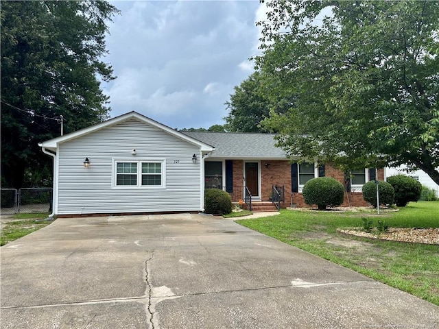 325 Hamilton St, Fayetteville, NC 28301 - ranch-style house featuring driveway, brick siding, and a shingled roof