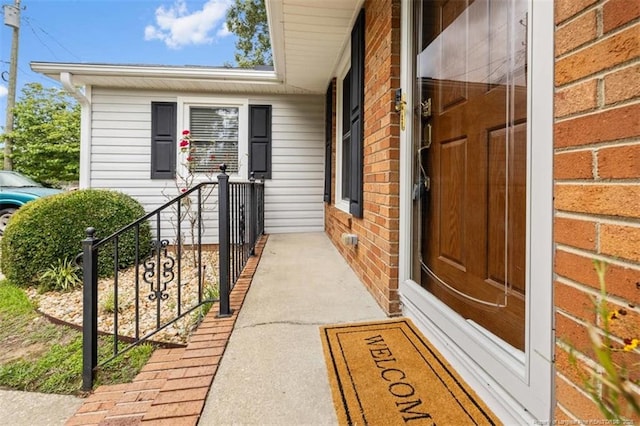 325 Hamilton St, Fayetteville, NC 28301 - doorway to property featuring brick siding