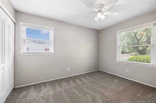 325 Hamilton St, Fayetteville, NC 28301 - unfurnished bedroom featuring carpet, a closet, and ceiling fan