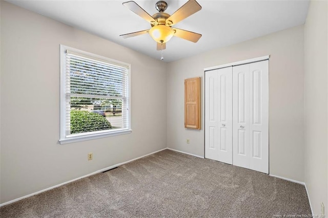 325 Hamilton St, Fayetteville, NC 28301 - unfurnished bedroom featuring carpet floors, a closet, and a ceiling fan