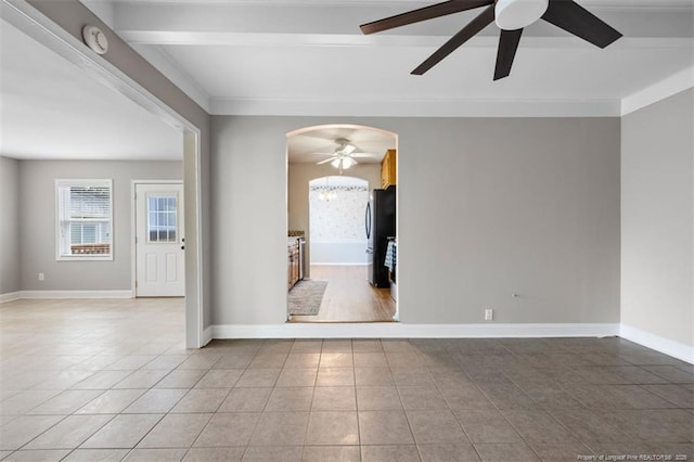 325 Hamilton St, Fayetteville, NC 28301 - empty room with a ceiling fan, light tile patterned floors, arched walkways, a smoke detector, and beam ceiling