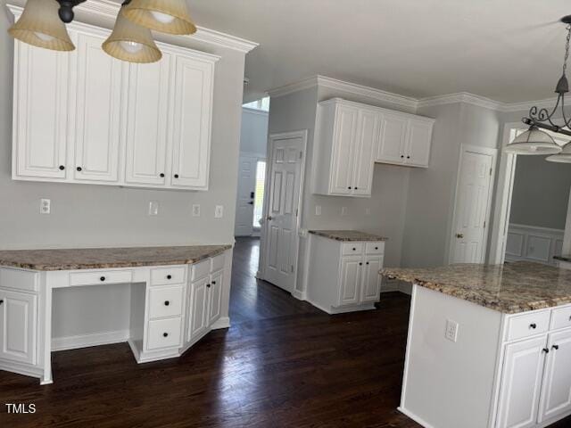 114 Council Gap Ct, Cary, NC 27513 - kitchen featuring built in study area, dark wood-style flooring, white cabinets, and crown molding