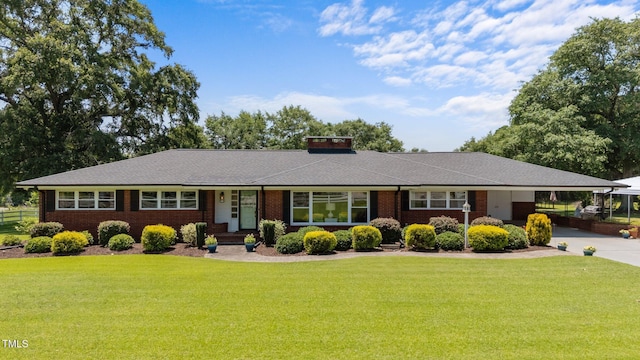 12082 NC-42, Fuquay Varina, NC 27526 - single story home with brick siding, a carport, and concrete driveway