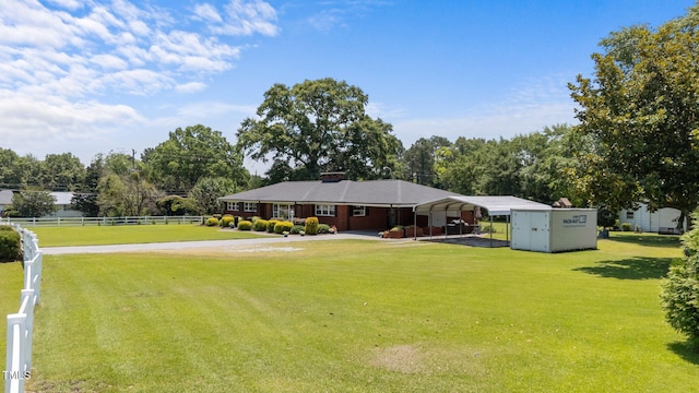 12082 NC-42, Fuquay Varina, NC 27526 - view of yard featuring a detached carport, view of scattered trees, and driveway