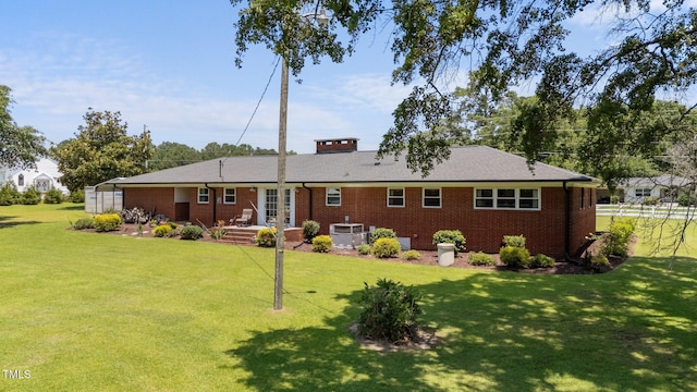 12082 NC-42, Fuquay Varina, NC 27526 - rear view of property featuring french doors, brick siding, and a lawn