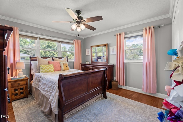 12082 NC-42, Fuquay Varina, NC 27526 - bedroom featuring wood finished floors, multiple windows, ornamental molding, ceiling fan, and a textured ceiling