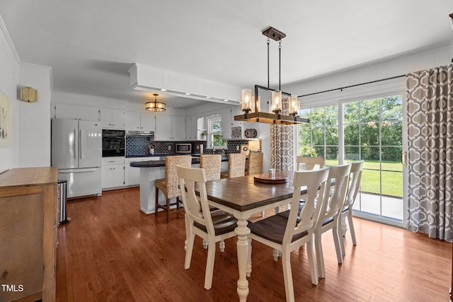 12082 NC-42, Fuquay Varina, NC 27526 - dining space with a chandelier and wood finished floors