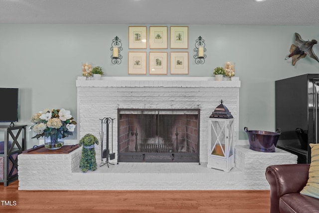 12082 NC-42, Fuquay Varina, NC 27526 - living room with a brick fireplace and wood finished floors