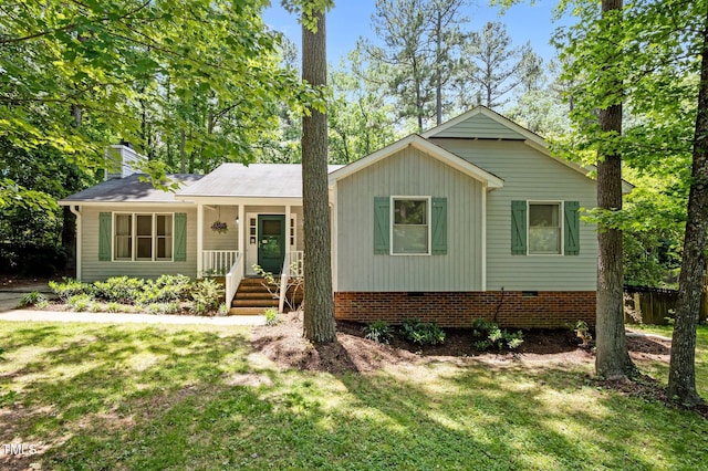 3007 Appling Way, Durham, NC 27703 - single story home with a front yard, a chimney, crawl space, and a porch