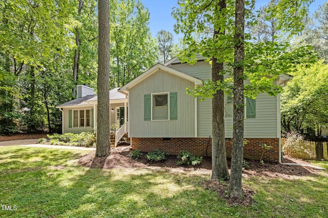 3007 Appling Way, Durham, NC 27703 - view of front facade with a front lawn, crawl space, and a chimney