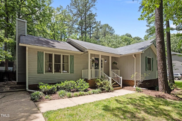 3007 Appling Way, Durham, NC 27703 - single story home with a chimney and a front lawn