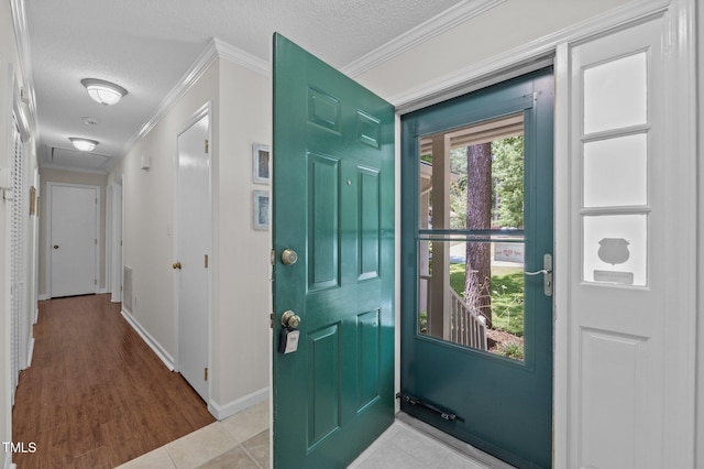 3007 Appling Way, Durham, NC 27703 - tiled entrance foyer featuring crown molding and a textured ceiling