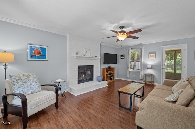 3007 Appling Way, Durham, NC 27703 - living room with ornamental molding, a fireplace, wood finished floors, and a ceiling fan