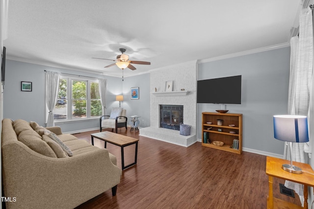 3007 Appling Way, Durham, NC 27703 - living room with ceiling fan, wood finished floors, crown molding, and a brick fireplace
