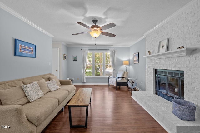 3007 Appling Way, Durham, NC 27703 - living area featuring a ceiling fan, dark wood finished floors, ornamental molding, a textured ceiling, and a fireplace
