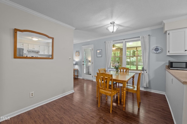 3007 Appling Way, Durham, NC 27703 - dining area with dark wood finished floors, ornamental molding, and a textured ceiling