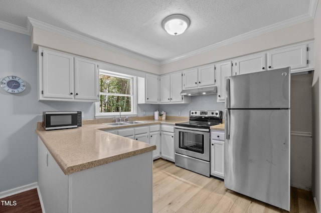 3007 Appling Way, Durham, NC 27703 - kitchen featuring appliances with stainless steel finishes, under cabinet range hood, a peninsula, ornamental molding, and white cabinets