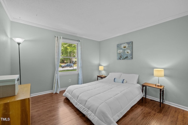 3007 Appling Way, Durham, NC 27703 - bedroom featuring ornamental molding and wood finished floors