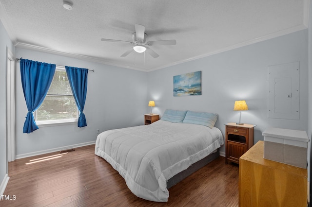 3007 Appling Way, Durham, NC 27703 - bedroom featuring electric panel, crown molding, dark wood-style floors, a textured ceiling, and a ceiling fan