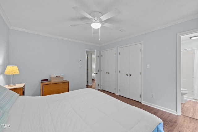 3007 Appling Way, Durham, NC 27703 - bedroom featuring wood finished floors, crown molding, connected bathroom, two closets, and a ceiling fan