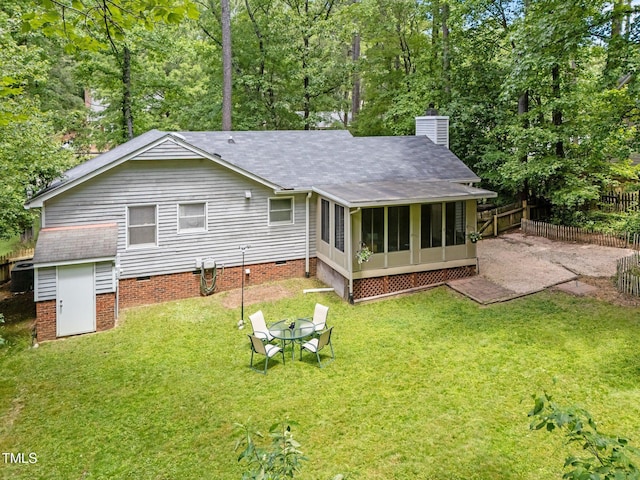 3007 Appling Way, Durham, NC 27703 - back of property with a chimney, roof with shingles, and a sunroom