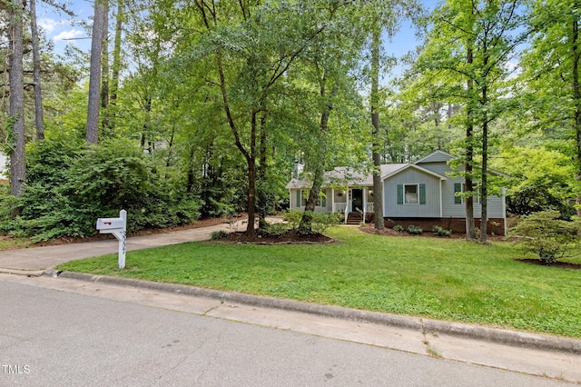 3007 Appling Way, Durham, NC 27703 - view of front of house with driveway, a front yard, and covered porch