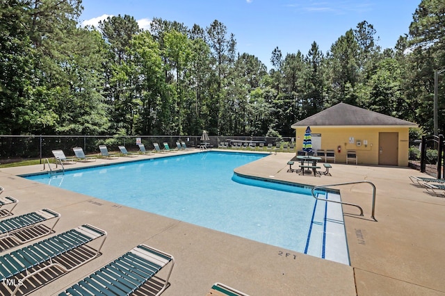 3007 Appling Way, Durham, NC 27703 - community pool featuring a patio area and view of scattered trees