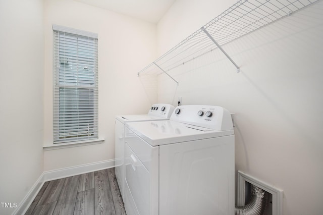 80 Nailsworth St, Angier, NC 27501 - washroom featuring washer and clothes dryer and wood finished floors