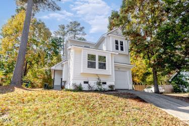 460 Dickens Dr, Raleigh, NC 27610 - view of front of home with asphalt driveway and an attached garage