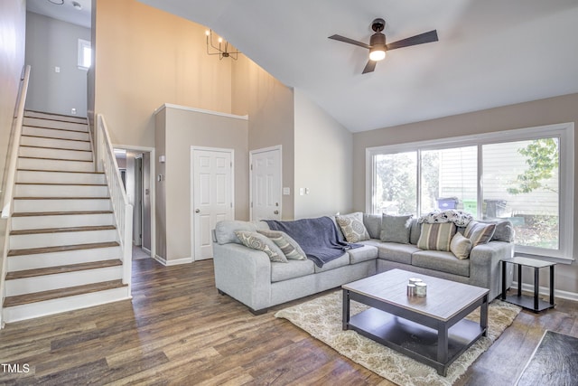 460 Dickens Dr, Raleigh, NC 27610 - living room with high vaulted ceiling, healthy amount of natural light, wood finished floors, a ceiling fan, and stairs