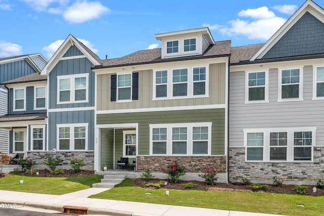 937 Baldwin Ridge Rd, Apex, NC 27523 - view of front of house featuring stone siding, board and batten siding, and roof with shingles