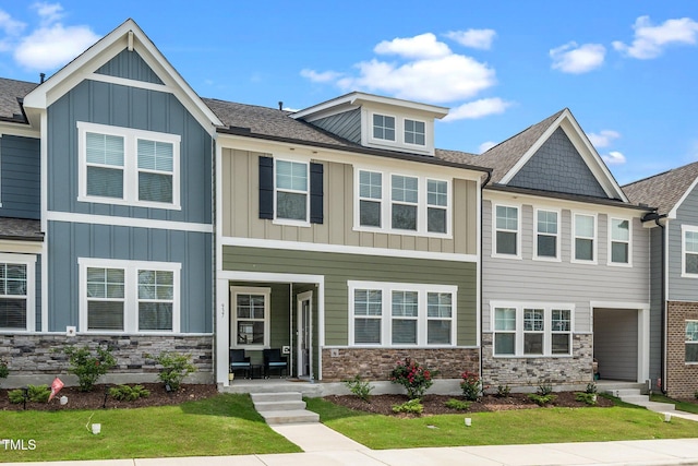 937 Baldwin Ridge Rd, Apex, NC 27523 - townhome / multi-family property featuring board and batten siding, stone siding, and a front lawn