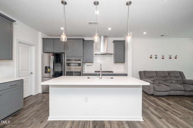 937 Baldwin Ridge Rd, Apex, NC 27523 - kitchen featuring wall chimney range hood, stainless steel appliances, gray cabinets, tasteful backsplash, and recessed lighting