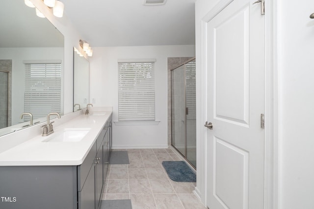 937 Baldwin Ridge Rd, Apex, NC 27523 - full bath with double vanity, a tile shower, and tile patterned flooring