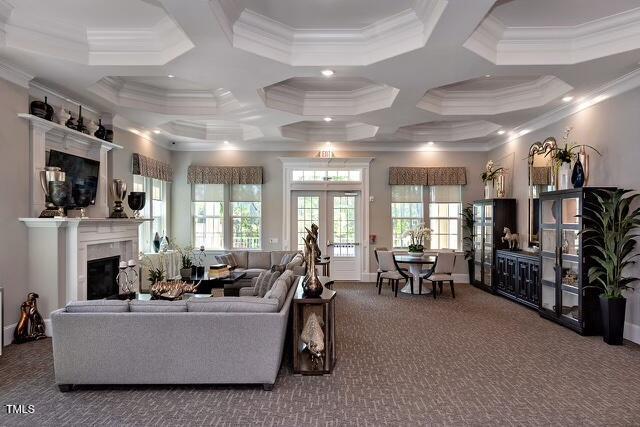 937 Baldwin Ridge Rd, Apex, NC 27523 - living room featuring carpet, french doors, a glass covered fireplace, crown molding, and coffered ceiling