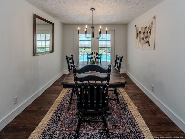 1554 Locklear Rd, Pembroke, NC 28372 - dining space with a textured ceiling, dark wood finished floors, and a chandelier