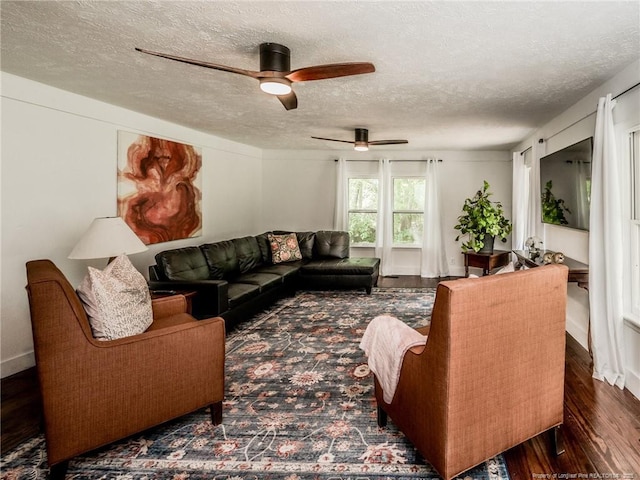 1554 Locklear Rd, Pembroke, NC 28372 - living room with a textured ceiling, a ceiling fan, and wood finished floors