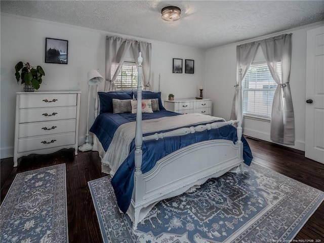 1554 Locklear Rd, Pembroke, NC 28372 - bedroom featuring a textured ceiling and wood finished floors