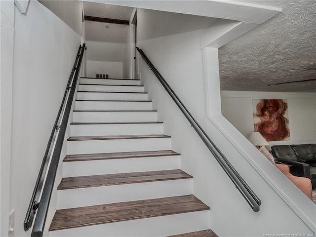 1554 Locklear Rd, Pembroke, NC 28372 - stairway with a textured ceiling