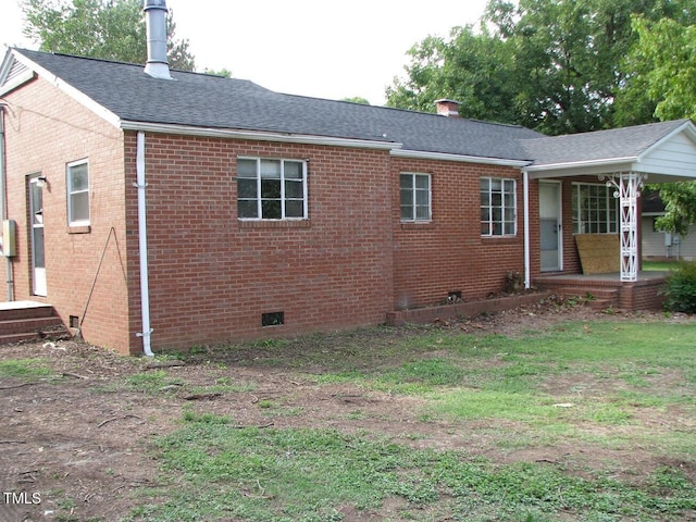 3514 S Alston Ave, Durham, NC 27713 - view of property exterior with brick siding, roof with shingles, crawl space, and a chimney