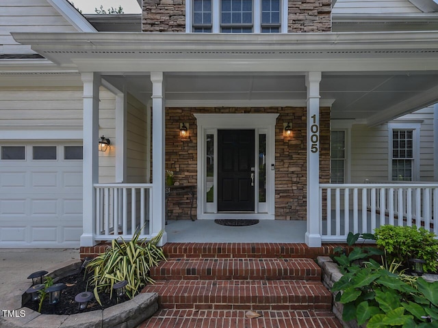 1005 Fairfax Woods Dr, Apex, NC 27502 - property entrance featuring covered porch and stone siding