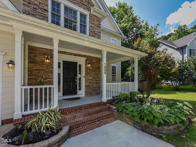 1005 Fairfax Woods Dr, Apex, NC 27502 - entrance to property with a porch and stone siding