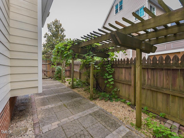 1005 Fairfax Woods Dr, Apex, NC 27502 - fenced backyard with a patio and a pergola