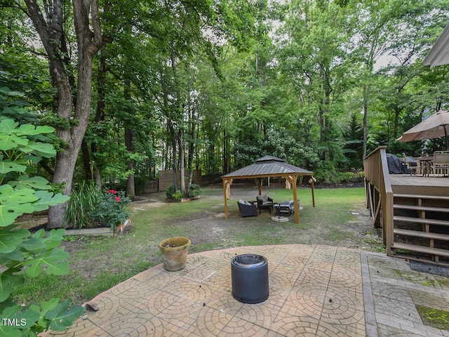 1005 Fairfax Woods Dr, Apex, NC 27502 - fenced backyard with a gazebo, a deck, a patio, and outdoor lounge area