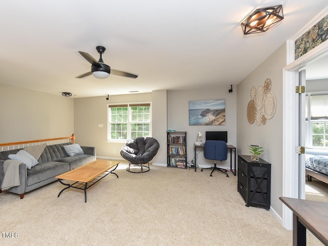 1005 Fairfax Woods Dr, Apex, NC 27502 - living area with carpet, plenty of natural light, and a ceiling fan